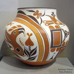 Parrot, cloud, rainbow, flower and geometric design on a polychrome jar