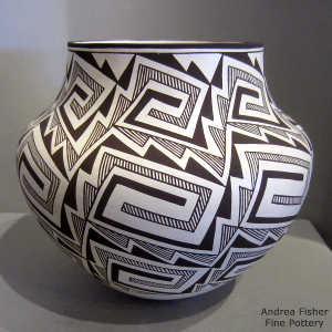 Lightning bolt, rain and interlocking key design on a black and white jar