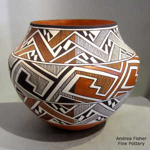 Lightning bolt, rain and interlocking key geometric design on a polychrome jar