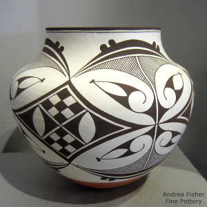 Bird element, medallion and geometirc design on a polychrome jar