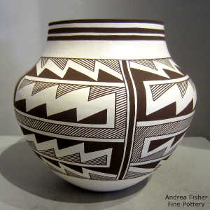 Lightning bolt, rain and geometric design on a black and white jar