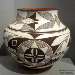 Medallion and geometric design on a black and white jar