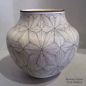 Snowflake fine line design on a black and white jar