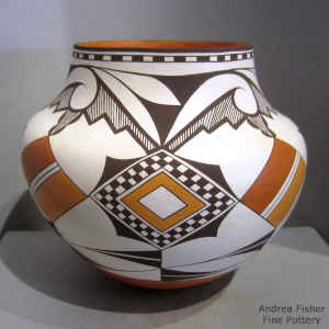 Checkerboard, medallion, rain cloud and geometric design on a polychrome jar