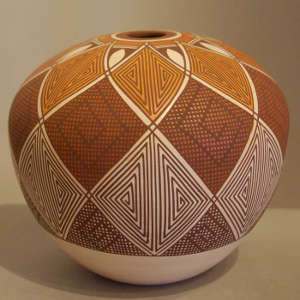 Fine line geometric design on a polychrome seedpot