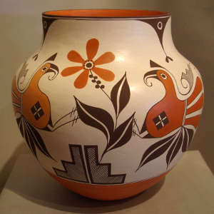 Parrot, floral and geometric design on a polychrome jar