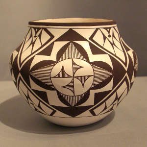 Medallion and geometric design on a black and white jar