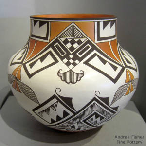 Shard and geometric design on a polychrome olla