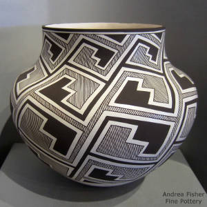 Interlocking kiva step and rain design on a black and white jar