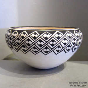 Interlocking kiva step and geometric design on a black and white bowl