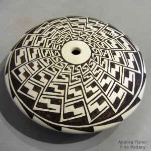 Geometric design on a black and white seed pot