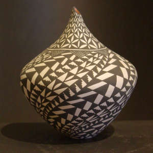 Swirl geometric design on a tall neck black and white jar