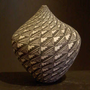 Geometric design on a black and white tear-shaped jar