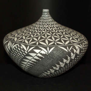 Geometric design on a black and white tear-shaped jar