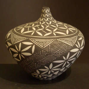 Swirl geometric design on a black and white tear-shaped jar