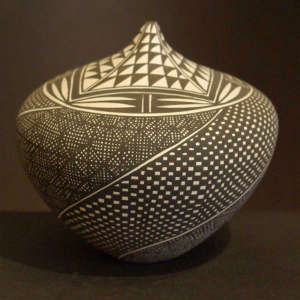 Geometric design on a black and white tear-shaped jar