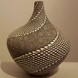Spiral geometric design on a black and white jar