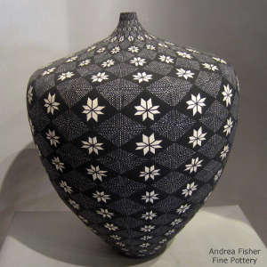 Geometric design on a thin neck black and white jar
