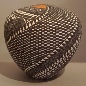 Spiral geometric design on a polychrome seed pot