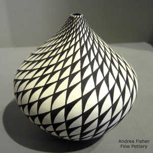 Step swirl design on a black and white tear drop jar