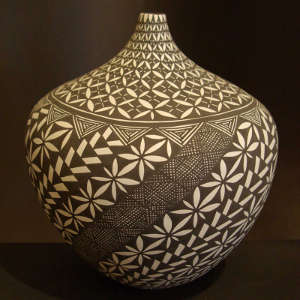 Geometric design on a black and white jar with a thin neck
