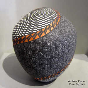Swirl, fine line and geometric design on a polychrome seed pot jar
