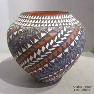 Fine line and geometric design on a polychrome jar