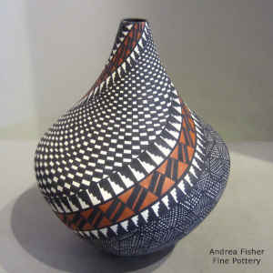 Fine line and geometric design on a polychrome tear drop jar