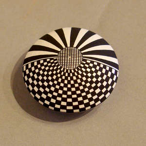 Geometric design on a black and white seed pot