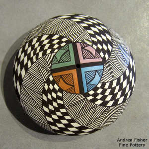 Checkerboard, fine line and geometric design on a polychrome seed pot