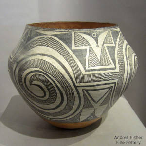 Mimbres spiral and geometric designs decorate a polychrome olla