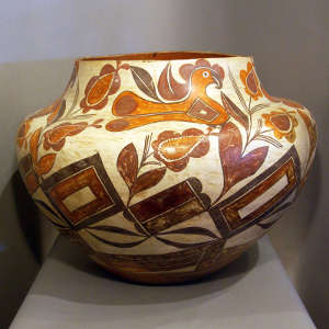Parrot, floral and geometric design on a polychrome jar
