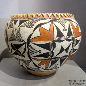 Cloud, rain, medallion and geometric design on a polychrome jar with a pie crust rim