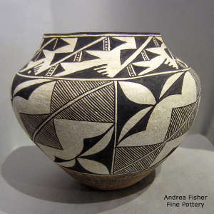 Rain, kiva step and geometric design on a polychrome jar