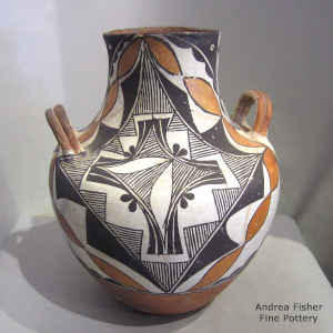 Handles and a geometric design on a polychrome jar