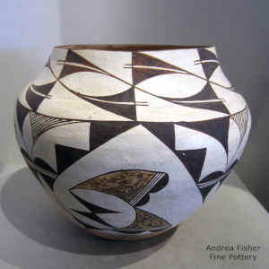 Cloud, rain and geometric design on a polychrome jar