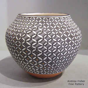 Pumpkin seed and geometric design on a polychrome jar