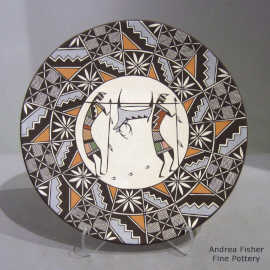 A pair of hunters carrying a deer and a geometric design on a polychrome plate