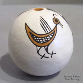 Mimbres bird and geometric design on a polychrome seed pot