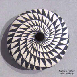 Spiral mesa geometric design on a miniature black-on-white seed pot