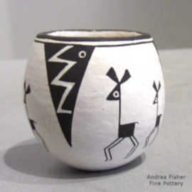 Mimbres animal, lightning bolt and geometric design on a miniature black-on-white bowl