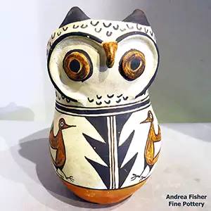 Bird element and geometric design on a polychrome owl figure
