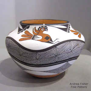 Parrot, snowflake fine line and geometric design on a polychrome jar