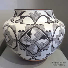 Polychrome jar with rain, cloud and geometric design