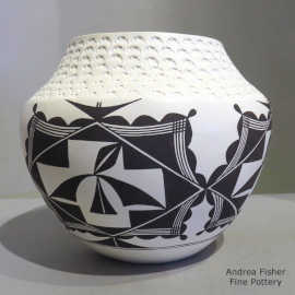 4-panel geometric design and a band of corrugation on a black-on-white jar