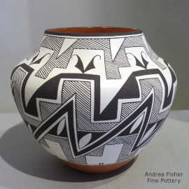 Black and white spiral, rain, kiva step and geometric design on a polychrome jar