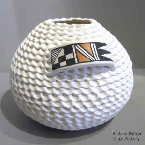 Corrugated surface and geometric design on a polychrome jar