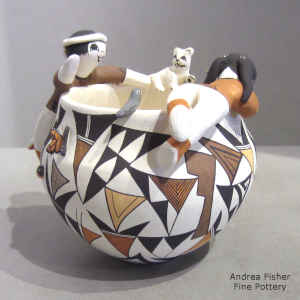 Geometric design on a friendship bowl with 2 children, birds, butterfly, kitten and lady bugs
