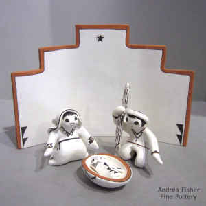 Joseph, Mary, baby-in-a-manger and a prayer wall in a nativity set