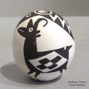 Mimbres antelope, Mimbres fish and a geometric design on a miniature black and white seed pot